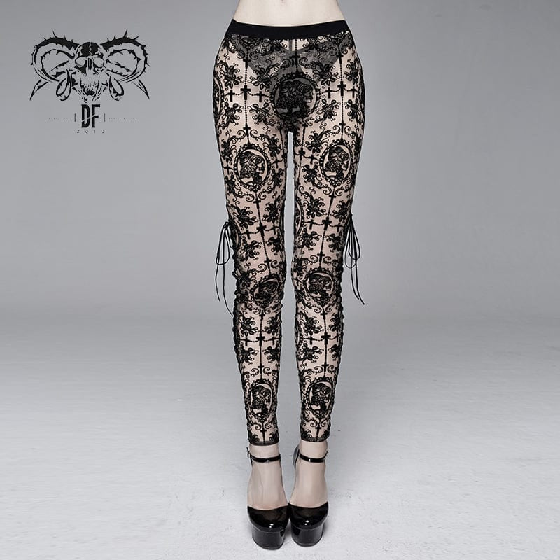 Front view of the Spirit of Evil Gothic Women's Leggings, showcasing the intricate sheer black brocade pattern and lace-up design along the front of the legs.