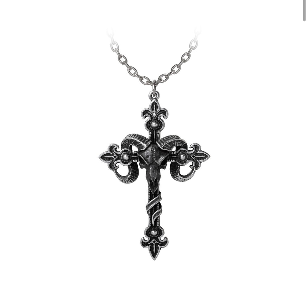 An intricate cross pendant with fleur-de-lys and scrollwork, impaled through a blackened ram’s skull with silver horns. Crafted in antiqued pewter, this bold necklace symbolizes dark occult power.