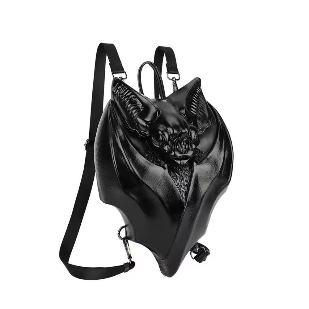 Front view of black bat-shaped handbag with outstretched wings and gothic detailing