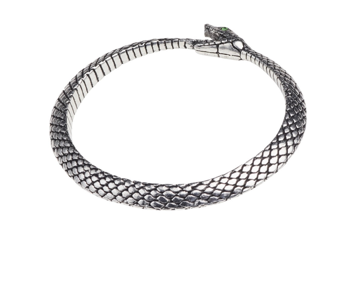 Close-up of The Wicked Serpent-Bangle featuring detailed serpent design and green crystal eyes, crafted from fine English pewter.