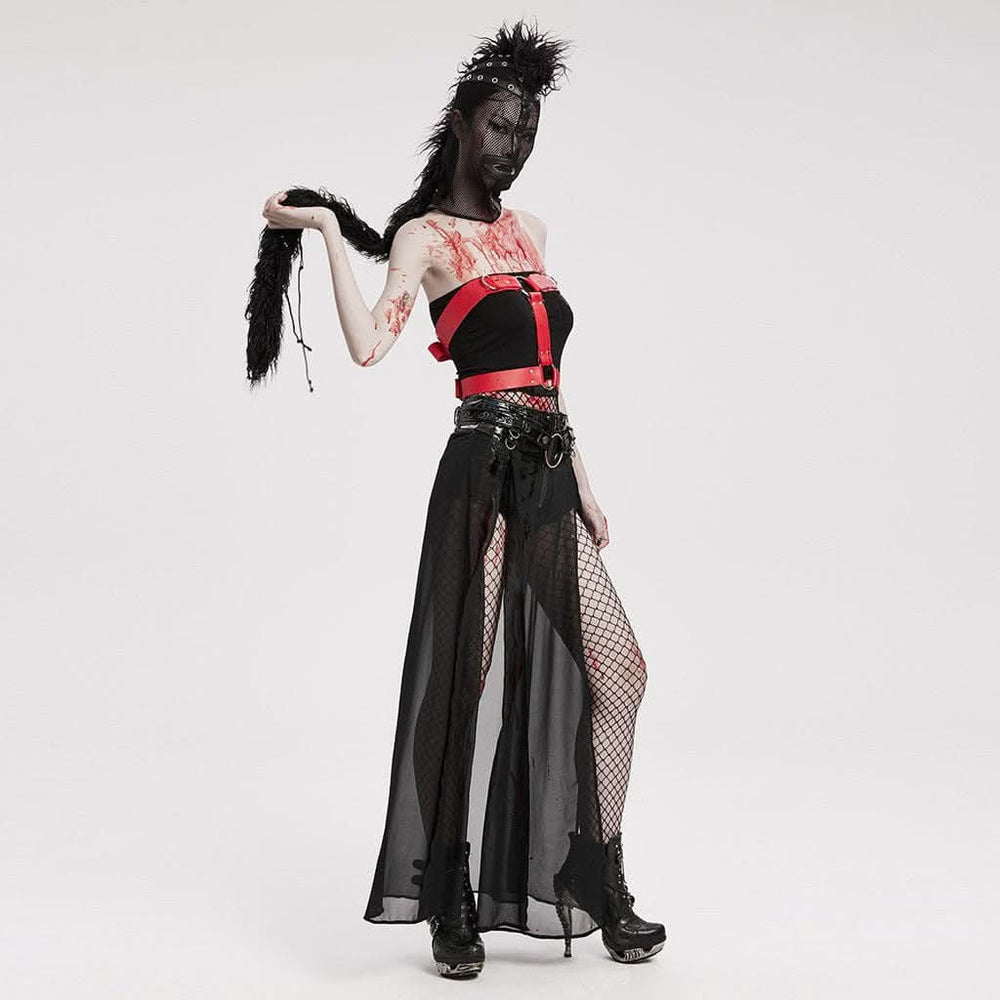 Model wearing black gothic punk mask with mohawk at a dark alternative fashion event