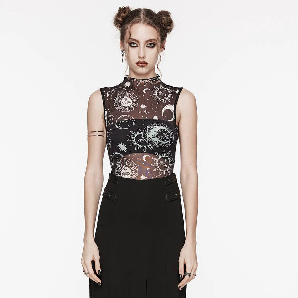 Model wearing the Coven celestial top. Slim fitted, sleeveless, with a mock neckline. Sheer black mesh fabric featuring a white astronomical pattern. Styled with gothic accessories.