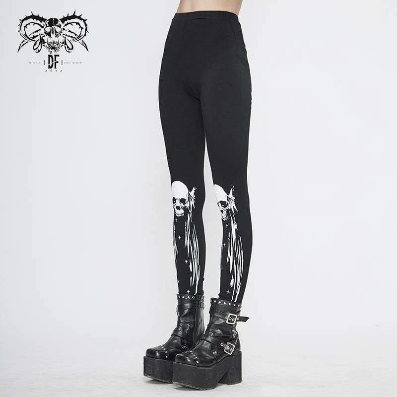 Side view of the Dance With The Devil Gothic Women's Black Leggings, showcasing the flattering slim fit and bold white skull print on the front.