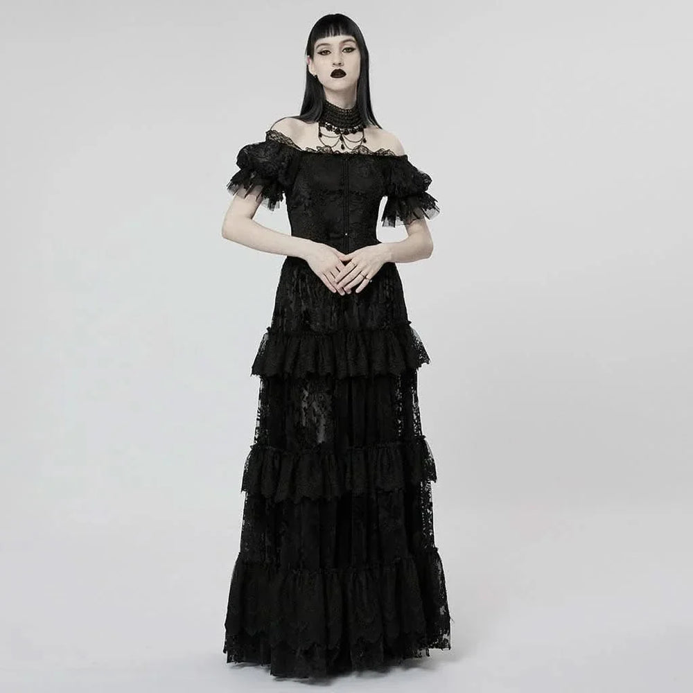 Full-length image of a model wearing the Graveyard Queen Dress, styled with gothic accessories against a moody backdrop.

