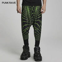 Model wearing Expletive Joggers featuring a neon green print and relaxed, low inseam fit.