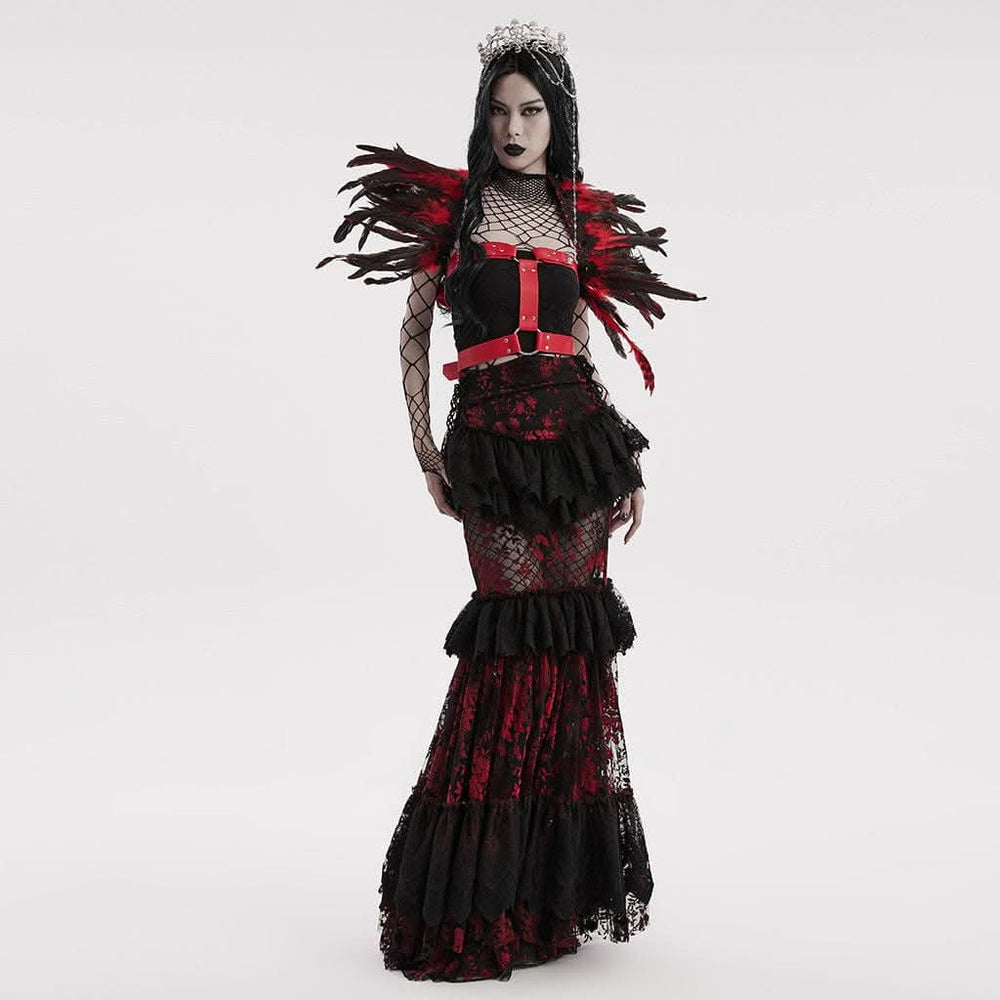 Model wearing red gothic winged harness styled with alternative fashion outfit